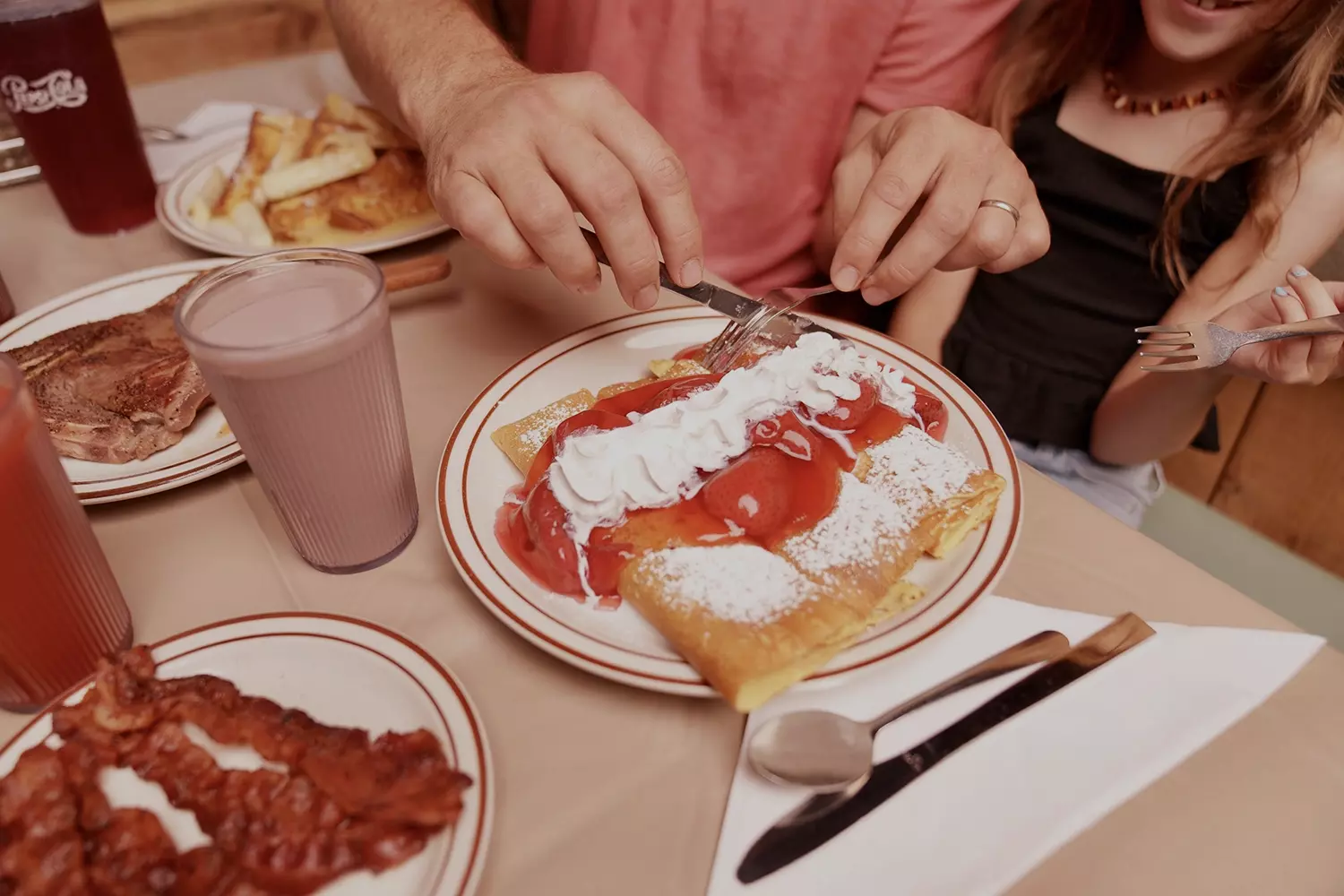 stack of crepes with berries