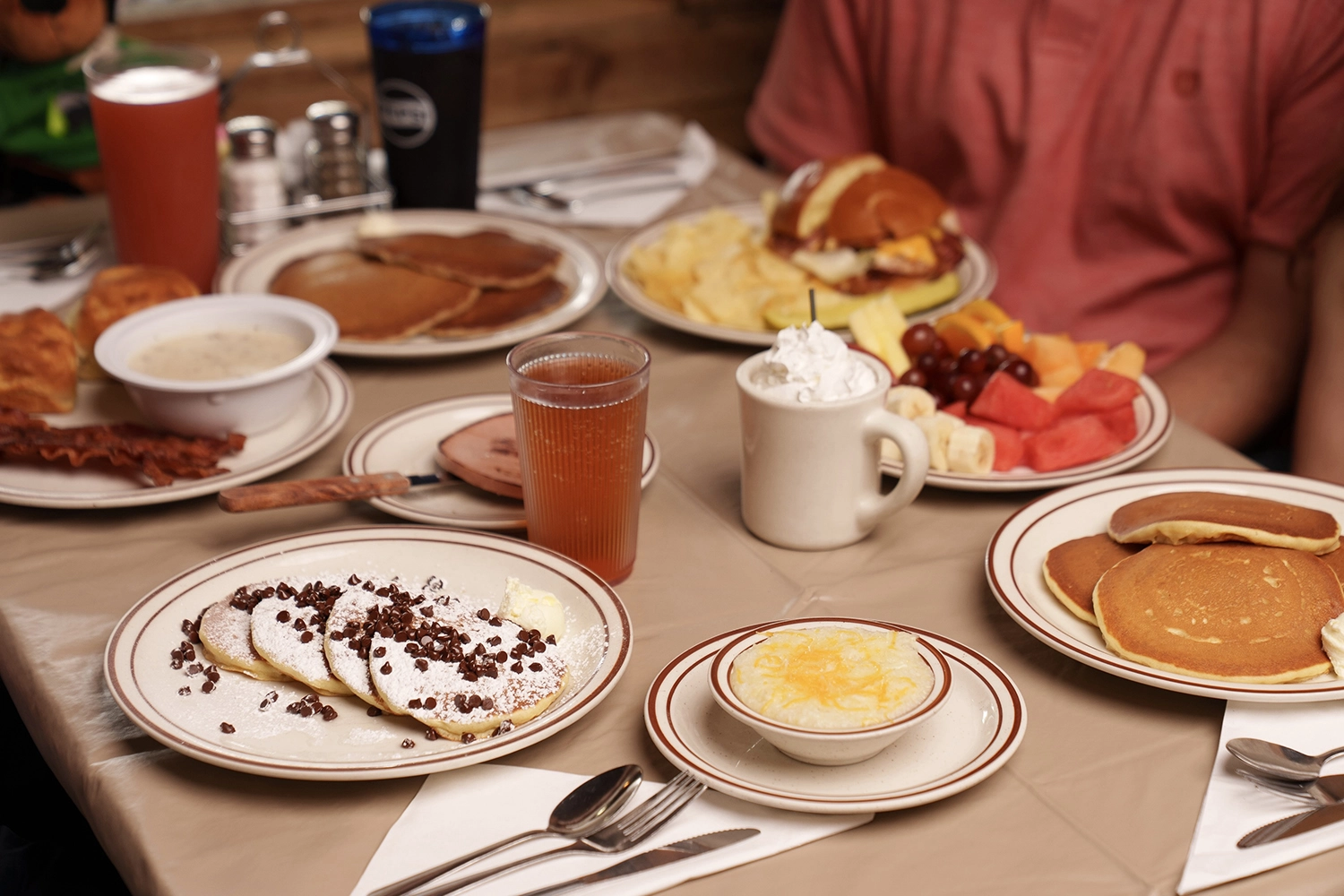 plates on a table with food at Log Cabin Pancake House